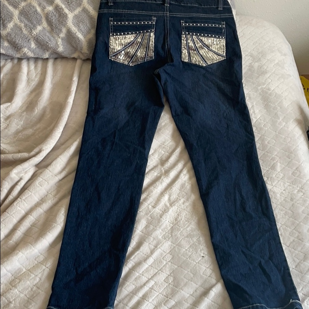 Bedazzled pocket blue jeans